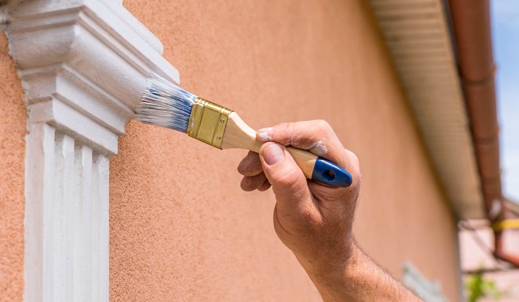 painting trim details of home